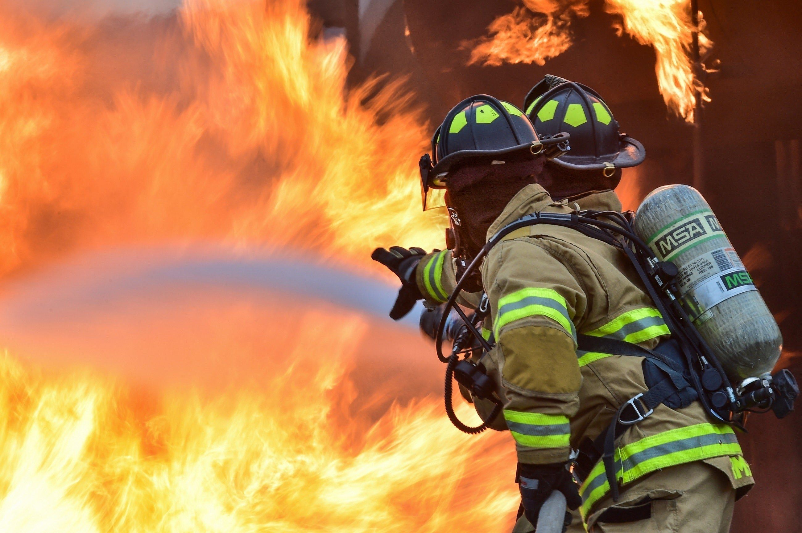 Firefighter tackling a large blaze