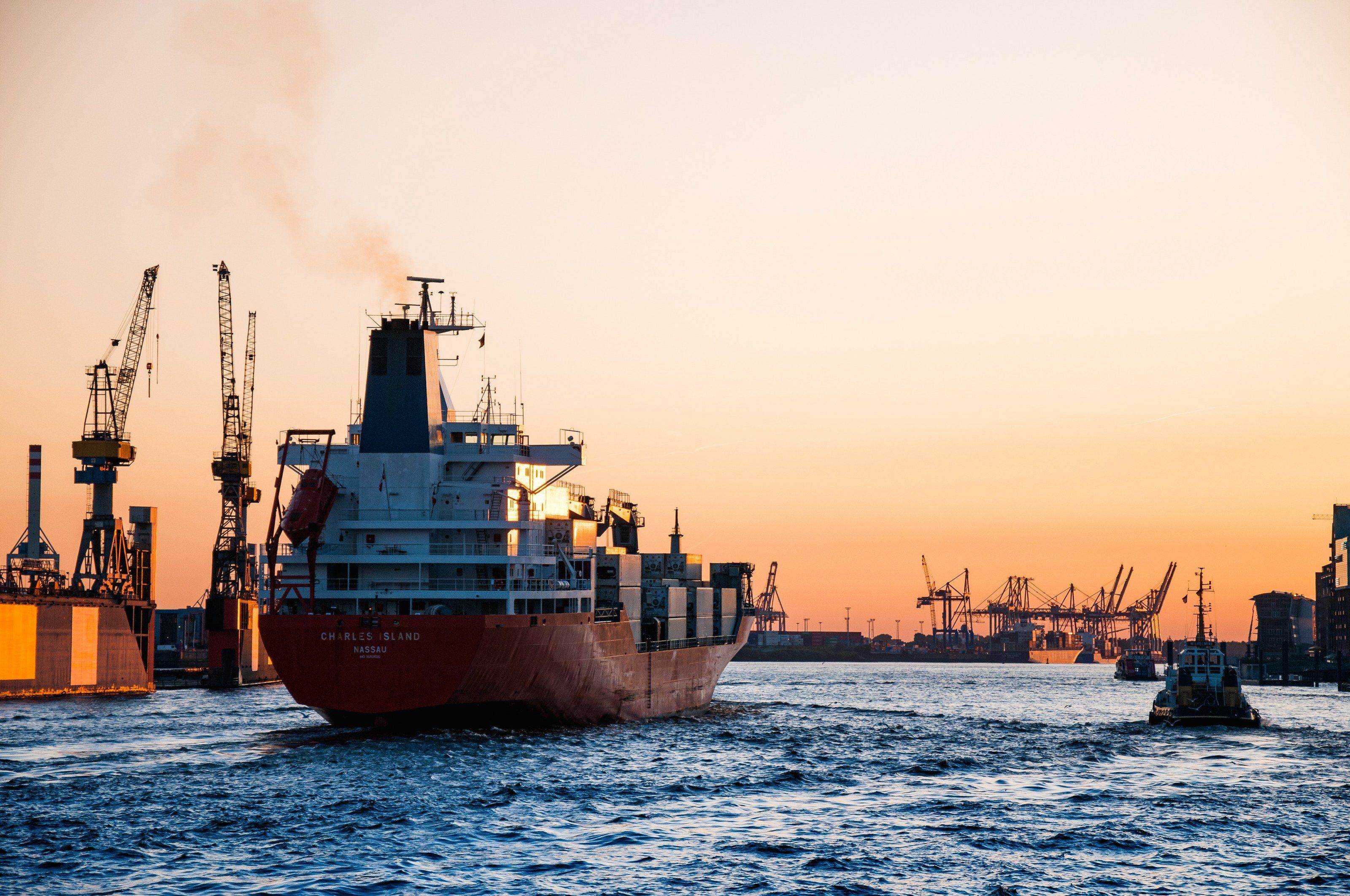 Cargo ship in port at dusk